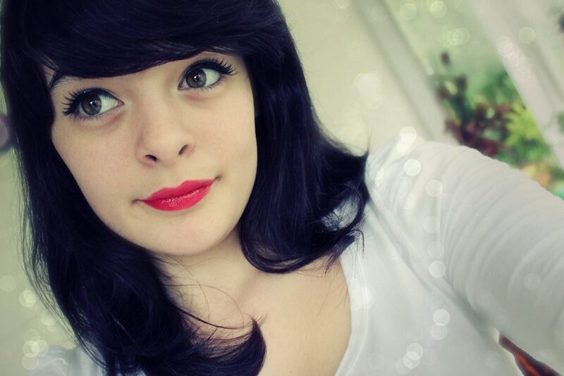 woman with dark hair and red lipstick