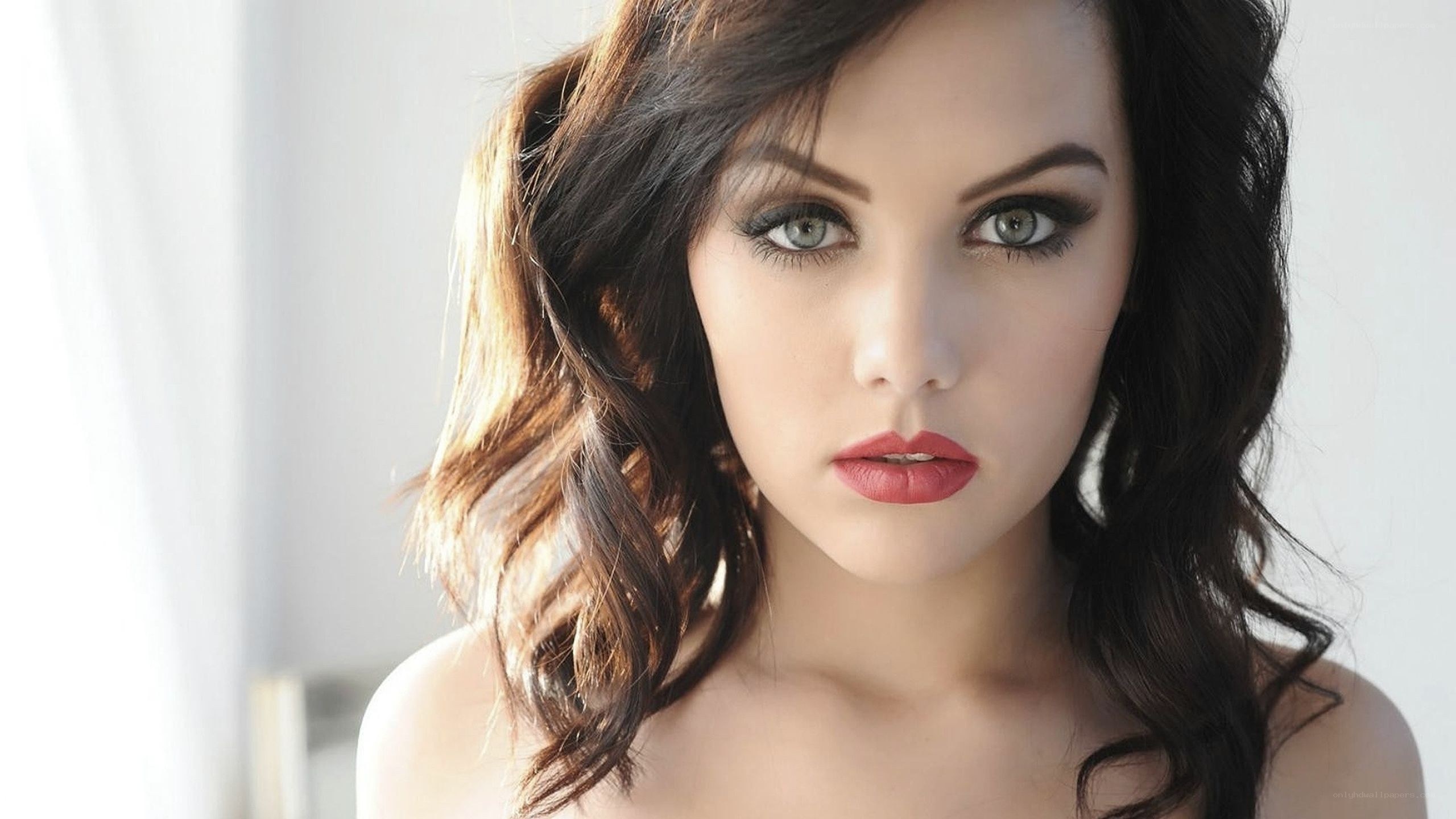 woman with dark hair and red lipstick