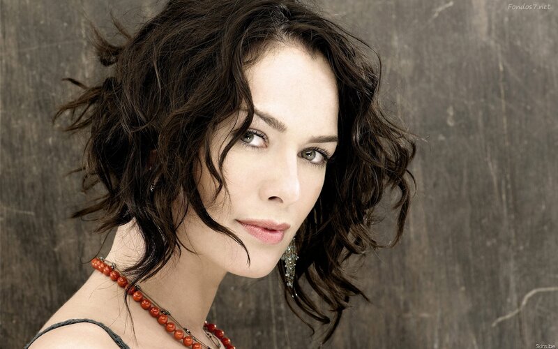 woman with dark hair and red necklace