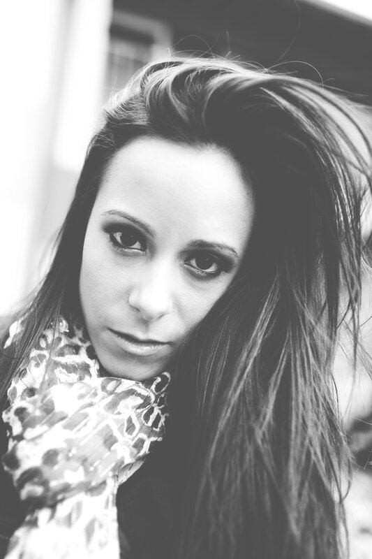 woman with dark hair and scarf