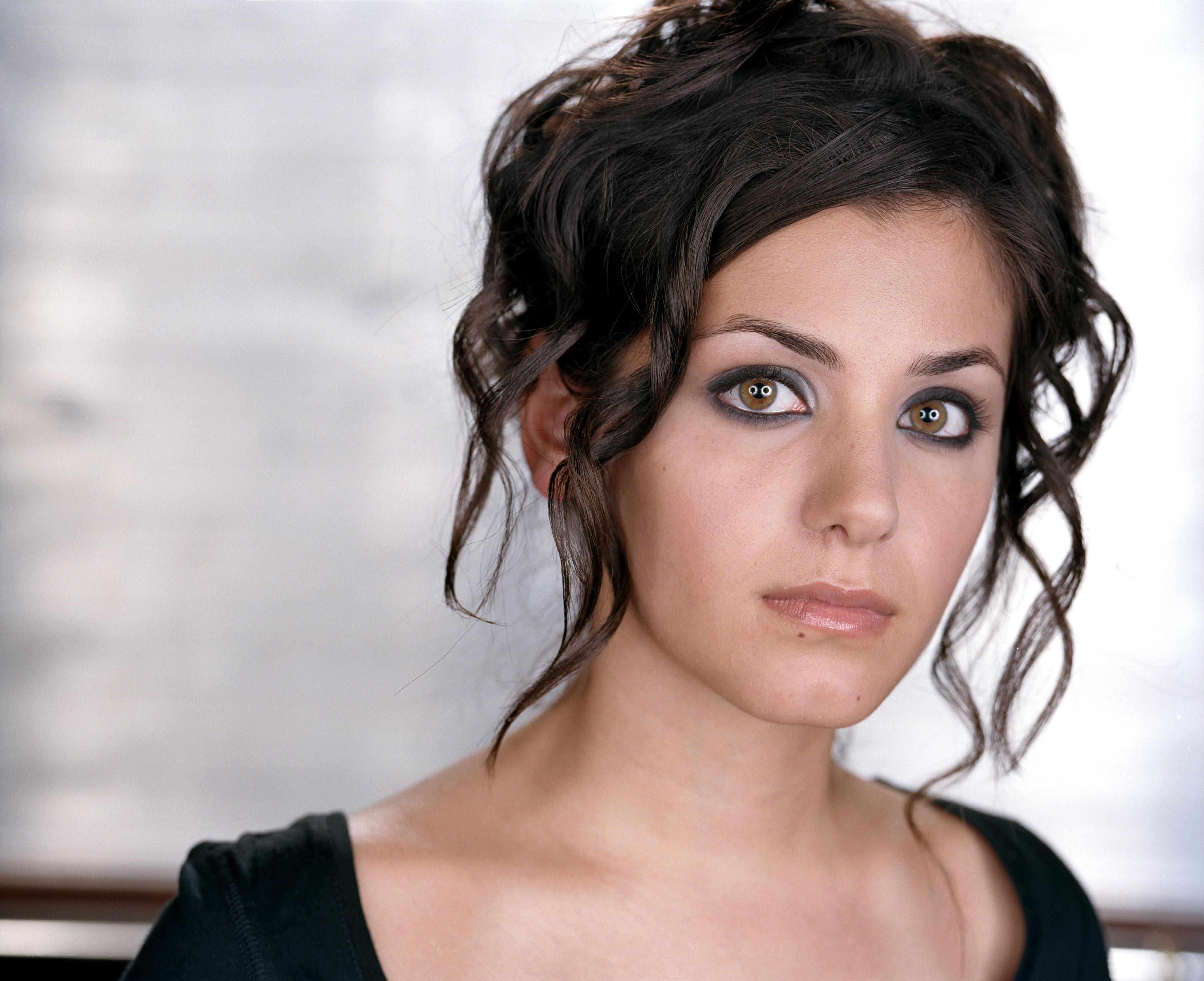 woman with dark hair and smoky eyes
