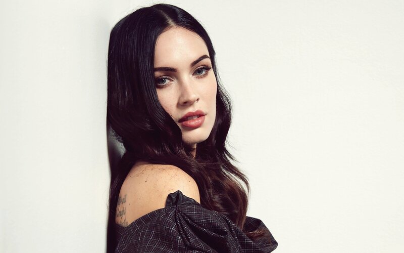 woman with dark hair and tattoo