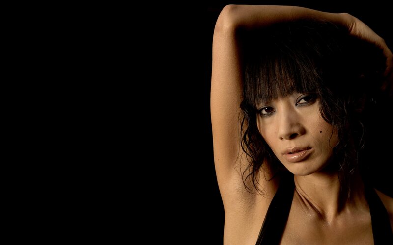 Woman with Dark Hair — Black, Dramatic, Photograph, Arm Raised
