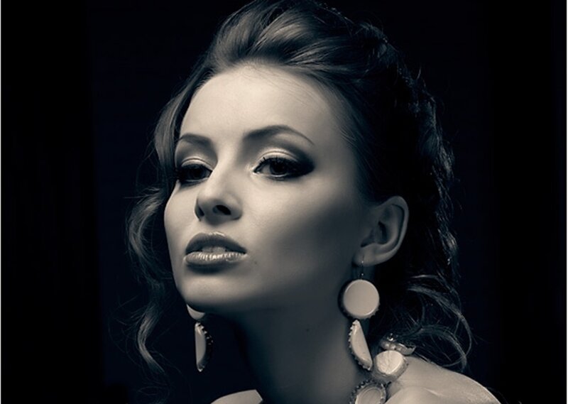 Woman with Dark Hair — Black, Dramatic, Photograph, Earrings, Makeup, Studio Lighting