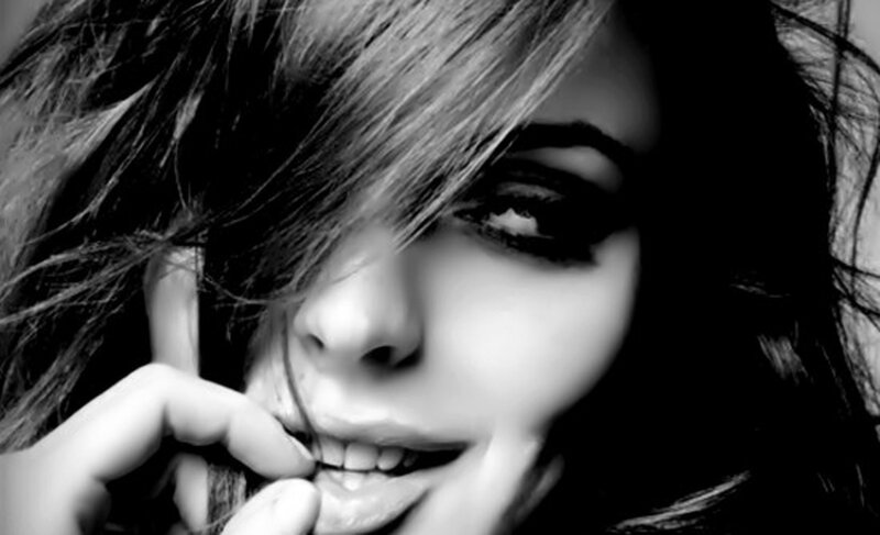 Woman with Dark Hair — Black, Dramatic, Photograph, Hand, Smile