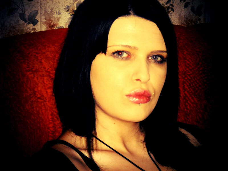 Woman with Dark Hair — Black, Dramatic, Photograph, Red Couch