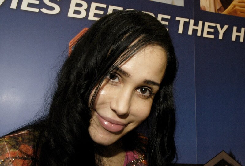 Woman with Dark Hair — Black, Neutral, Photograph, Blue Wall