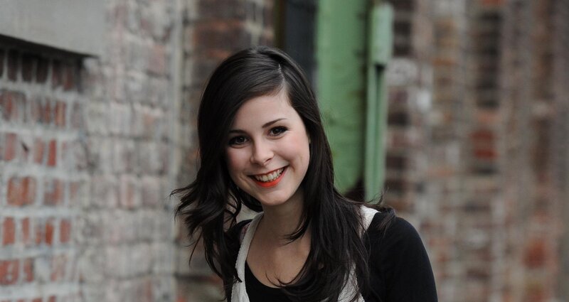 Woman with Dark Hair — Black, Neutral, Photograph, Brick Wall