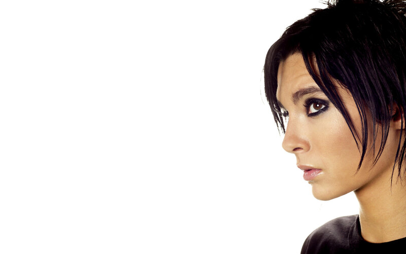 Woman with Dark Hair — Black, Serious, Photograph, Black Shirt, White Background