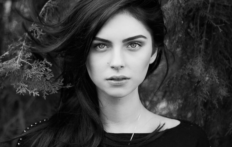 Woman with Dark Hair — Black, Serious, Photograph, Eyes, Branches