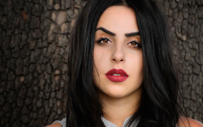 Woman with Dark Hair — Black, Serious, Photograph, Tree Bark