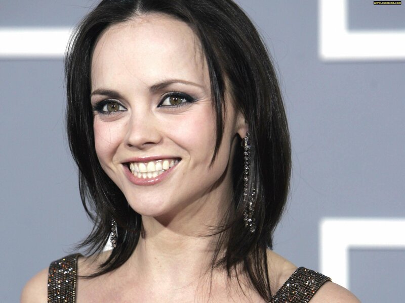 Woman with Dark Hair — Black, Smiling, Photograph, Earrings, Dress