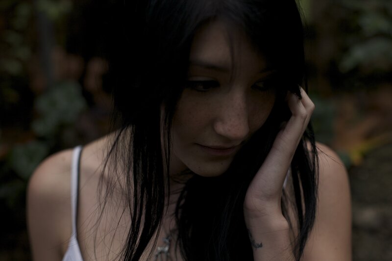 Woman with Dark Hair — Black, Somber, Photograph
