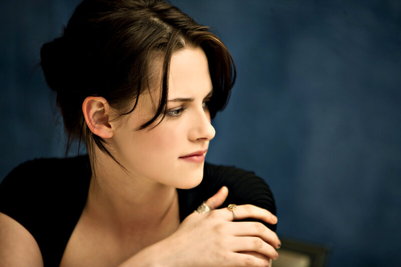 Woman with Dark Hair — Blue, Contemplative, Photograph, Black Top