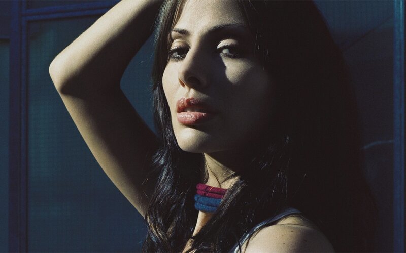 Woman with Dark Hair — Blue, Dramatic, Photograph, Arm Raised