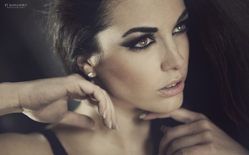Woman with Dark Hair — Brown, Dramatic, Photograph, Earring, Makeup, Hand