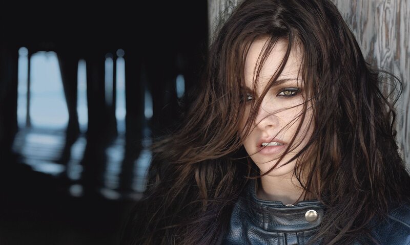 Woman with Dark Hair — Brown, Dramatic, Photograph, Leather Jacket, Wood Wall