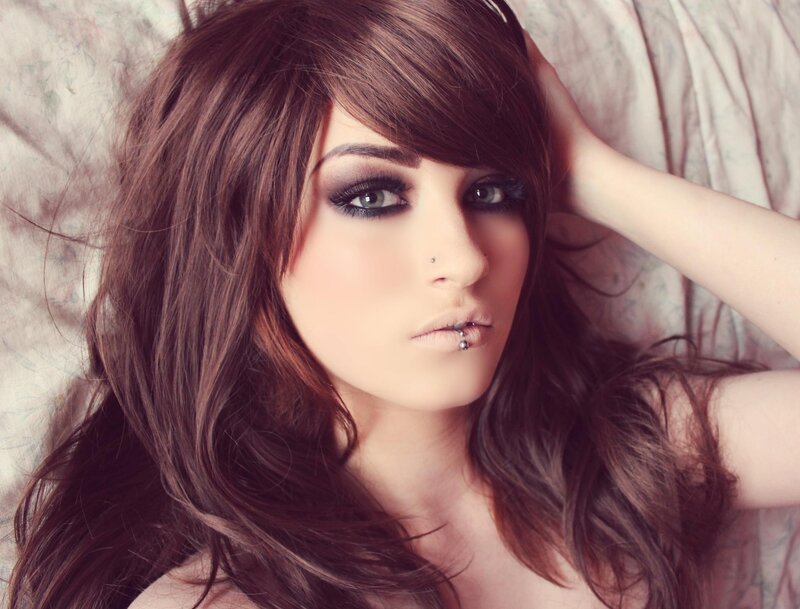Woman with Dark Hair — Brown, Dramatic, Photograph, Makeup, Piercings, Bed
