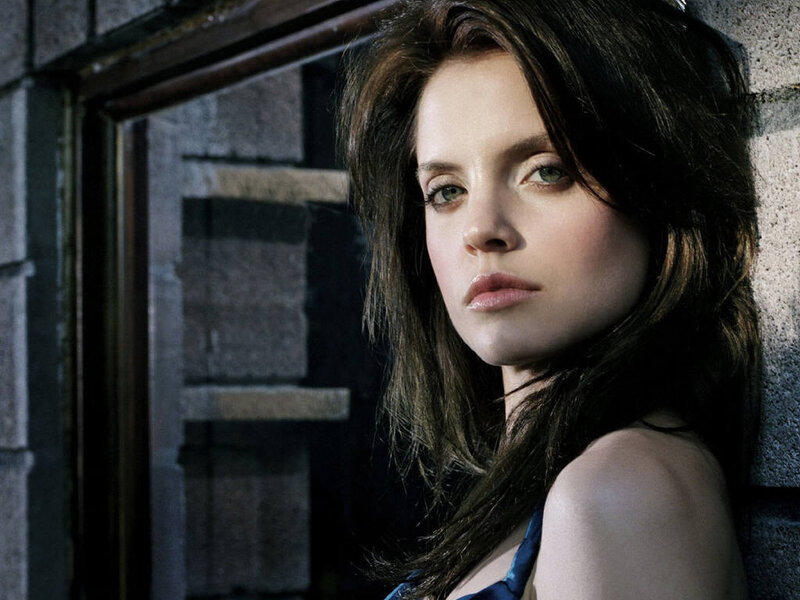 Woman with Dark Hair — Brown, Dramatic, Photograph, Stone Wall