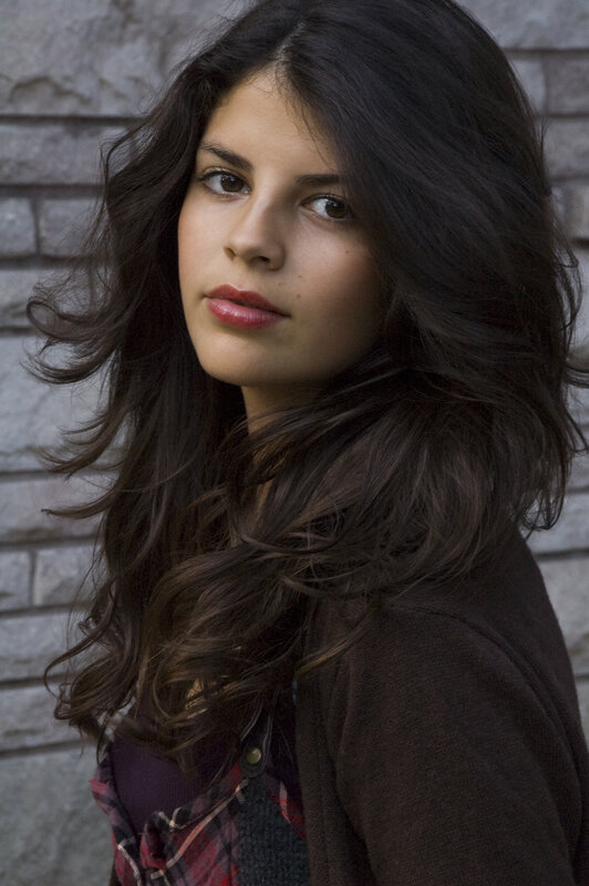 Woman with Dark Hair — Brown, Neutral, Photograph, Brick Wall, Plaid Shirt