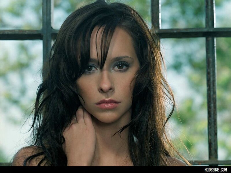 woman with dark hair by window