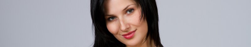Woman with Dark Hair — Gray, Neutral, Photograph, Smile, Green Eyes