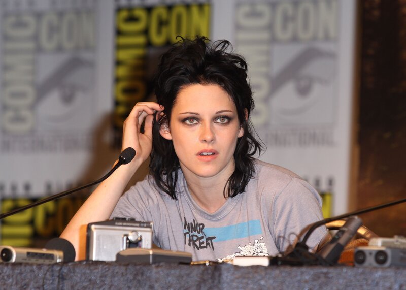 Woman with Dark Hair — Gray, Serious, Photograph, Microphone