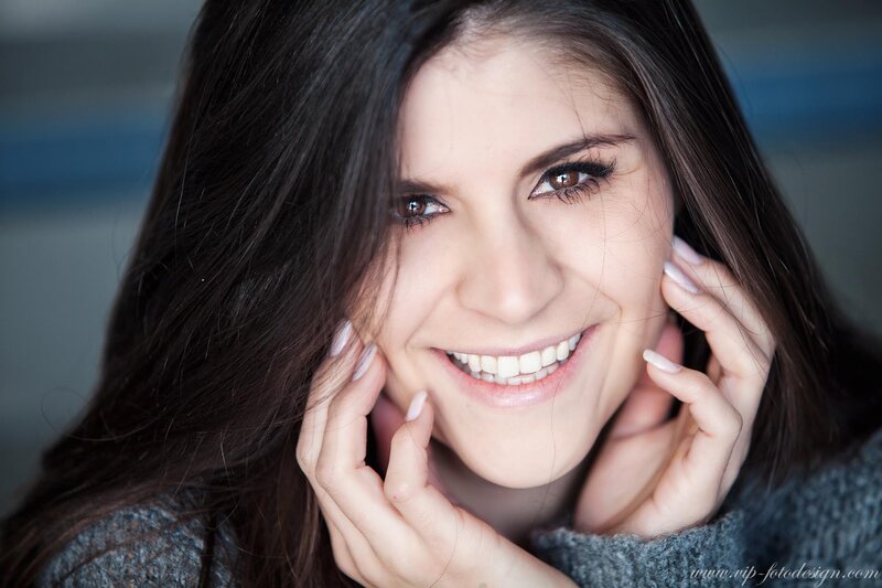 Woman with Dark Hair — Gray, Smiling, Photograph, Hands