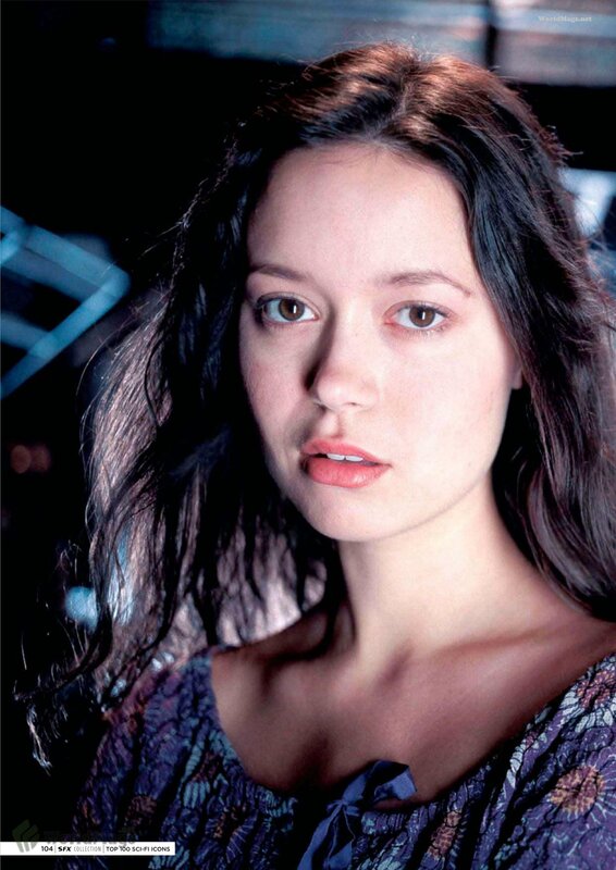 woman with dark hair in a patterned top