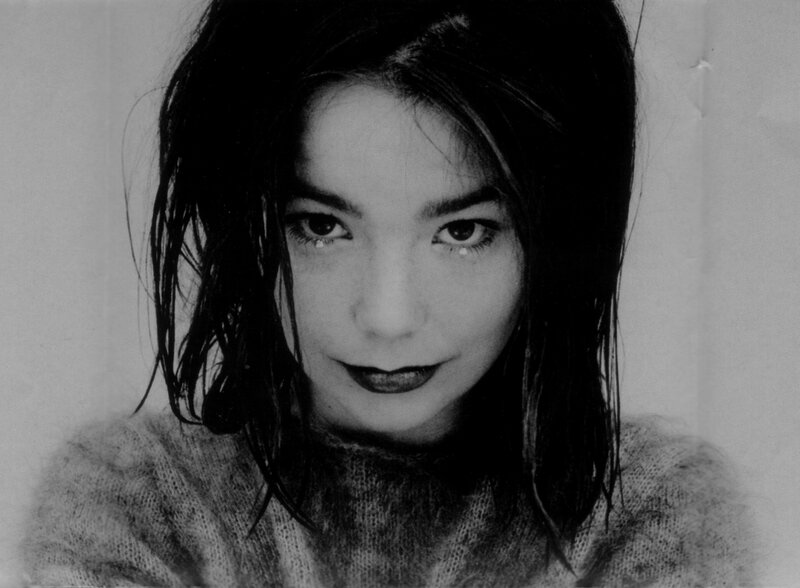 woman with dark hair in black and white