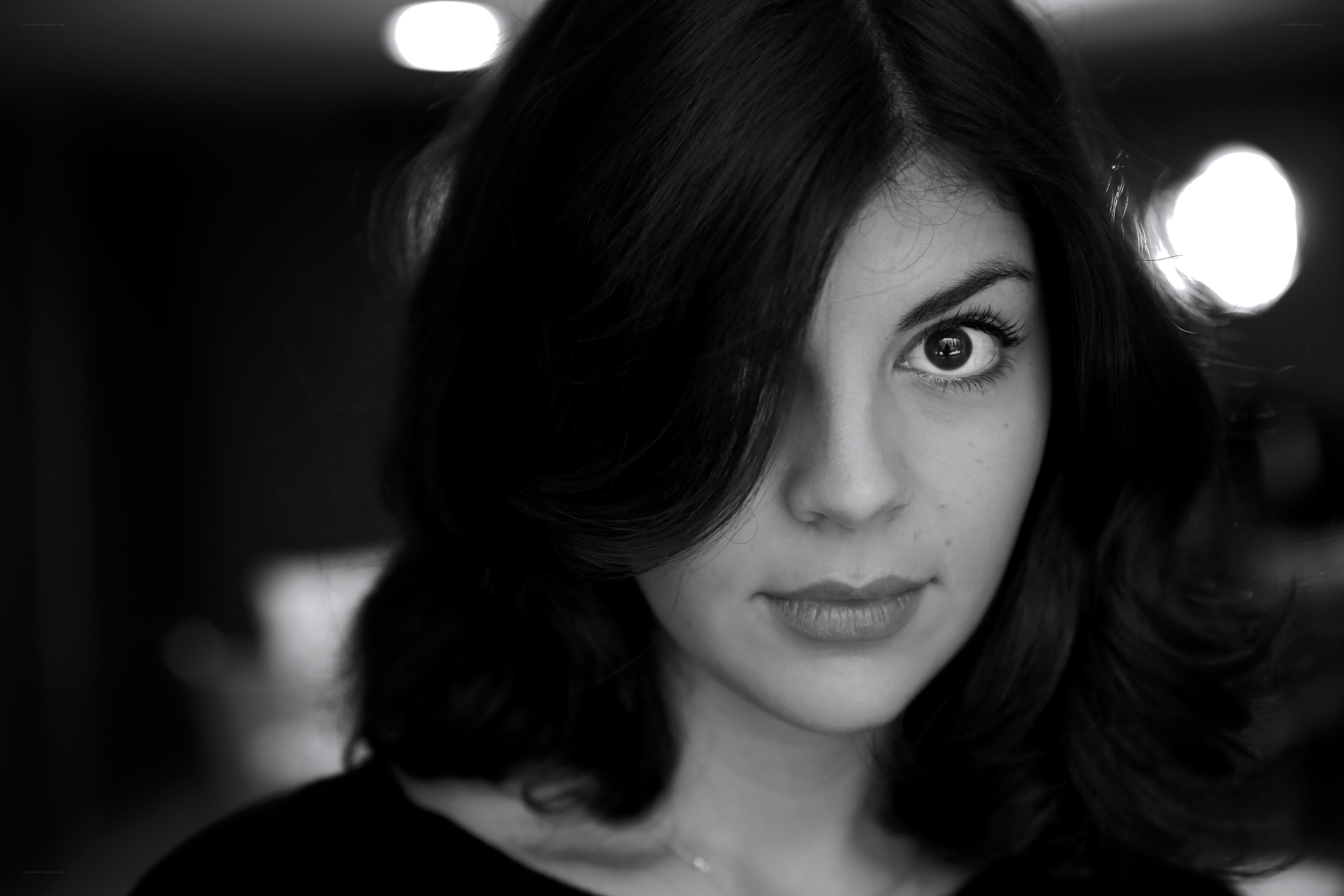 woman with dark hair in black and white