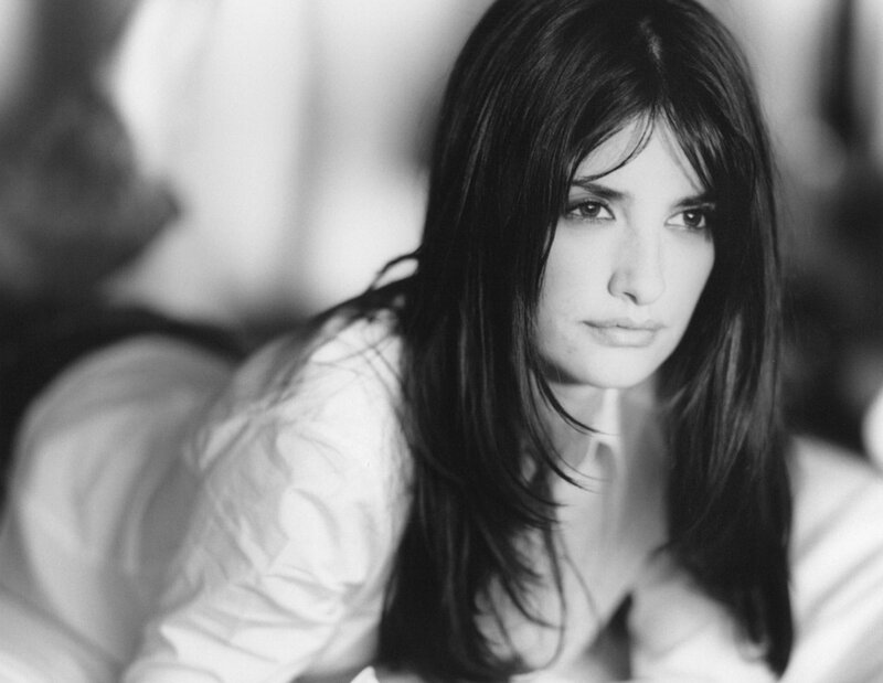woman with dark hair in black and white