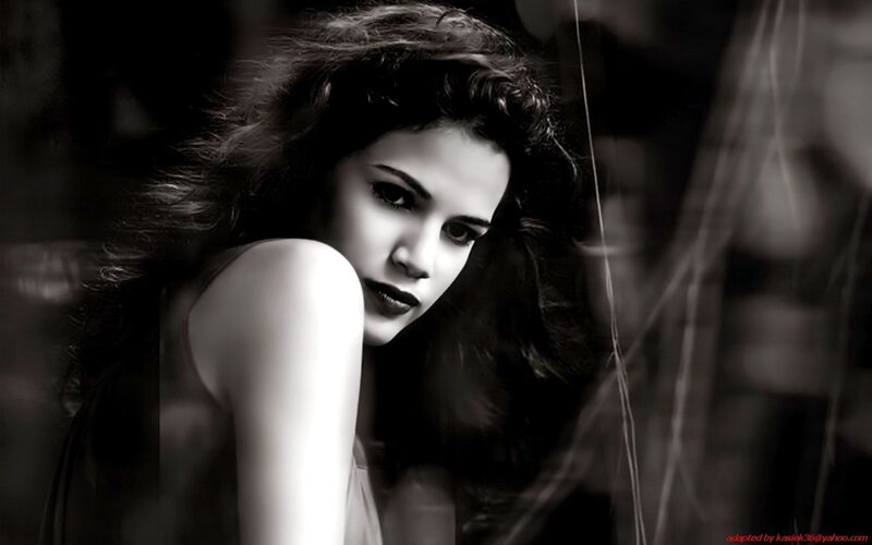 woman with dark hair in black and white