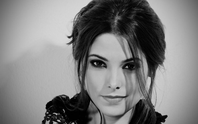 woman with dark hair in black and white