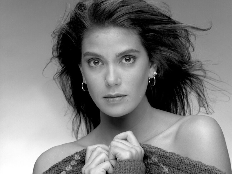 woman with dark hair in black and white