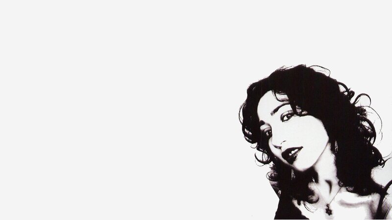 woman with dark hair in black and white