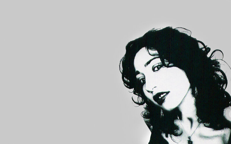 woman with dark hair in black and white