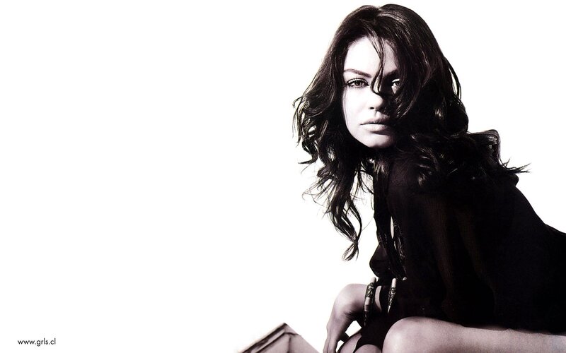 woman with dark hair in black and white