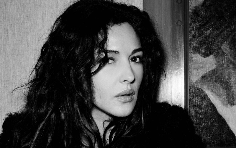 woman with dark hair in black and white