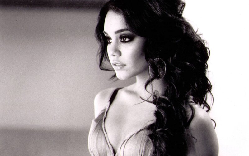 woman with dark hair in black and white