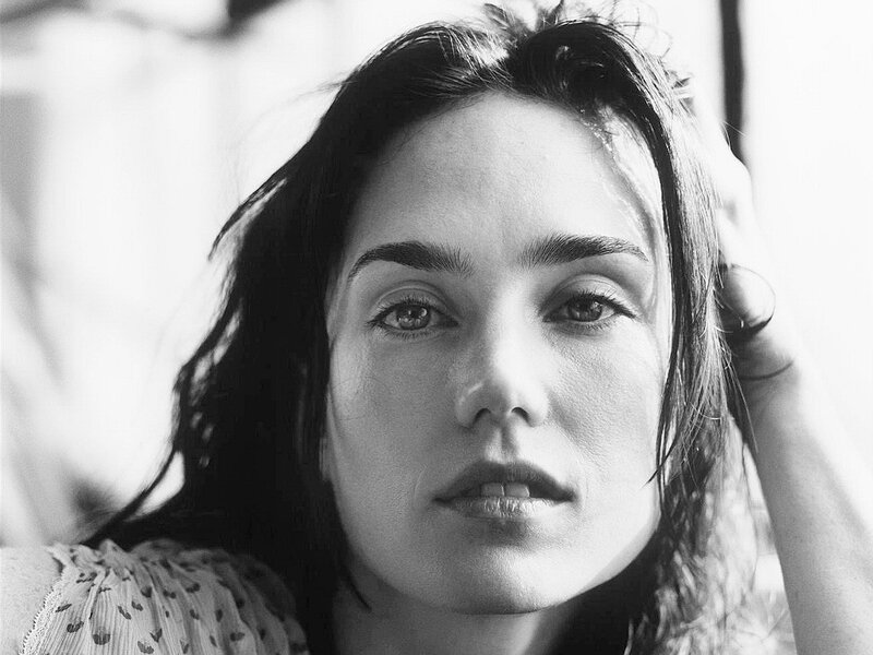 woman with dark hair in black and white