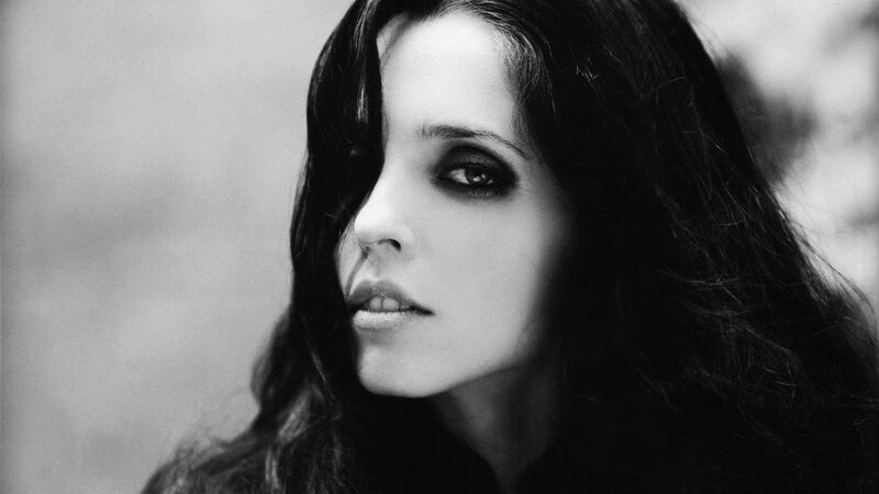 woman with dark hair in black and white