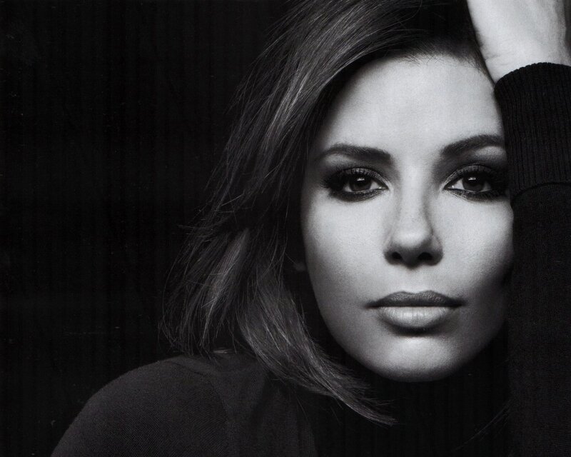 woman with dark hair in black and white