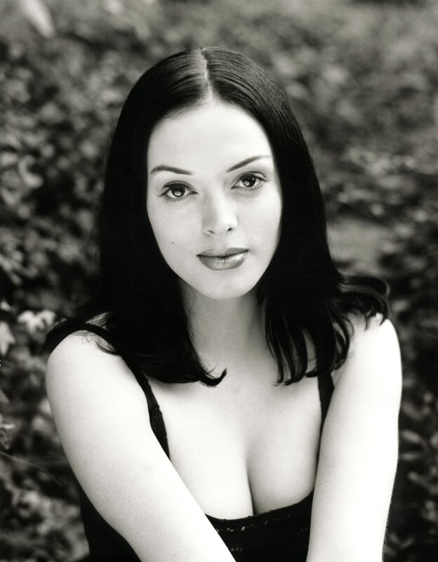 woman with dark hair in black and white
