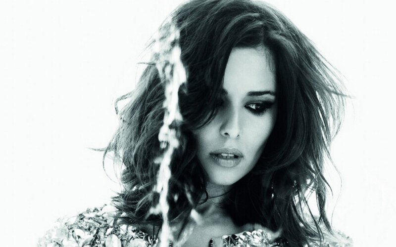 woman with dark hair in black and white