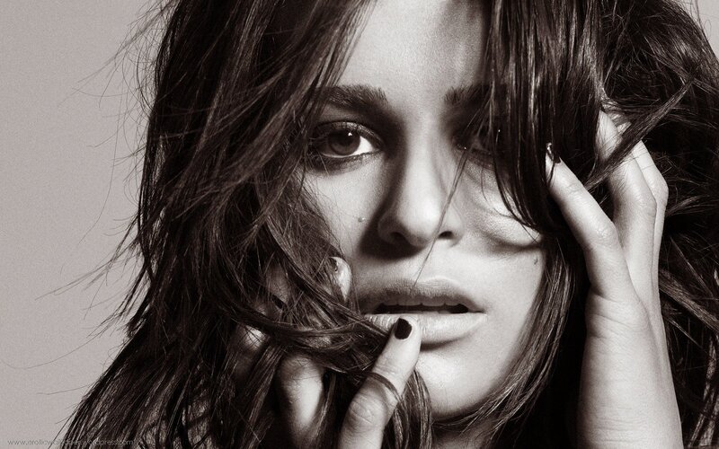 woman with dark hair in black and white