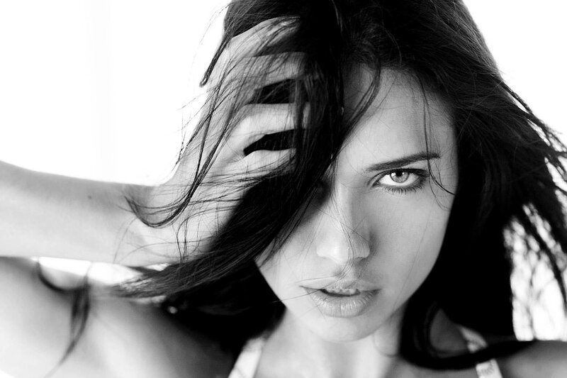 woman with dark hair in black and white