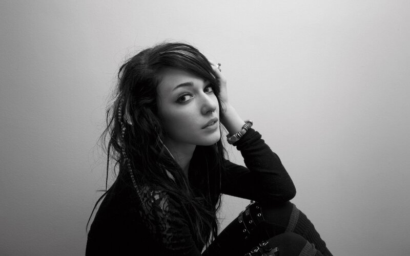 woman with dark hair in black and white