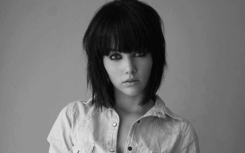 woman with dark hair in black and white