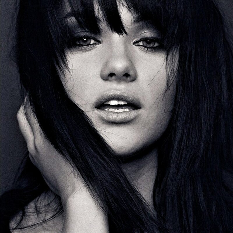 woman with dark hair in black and white